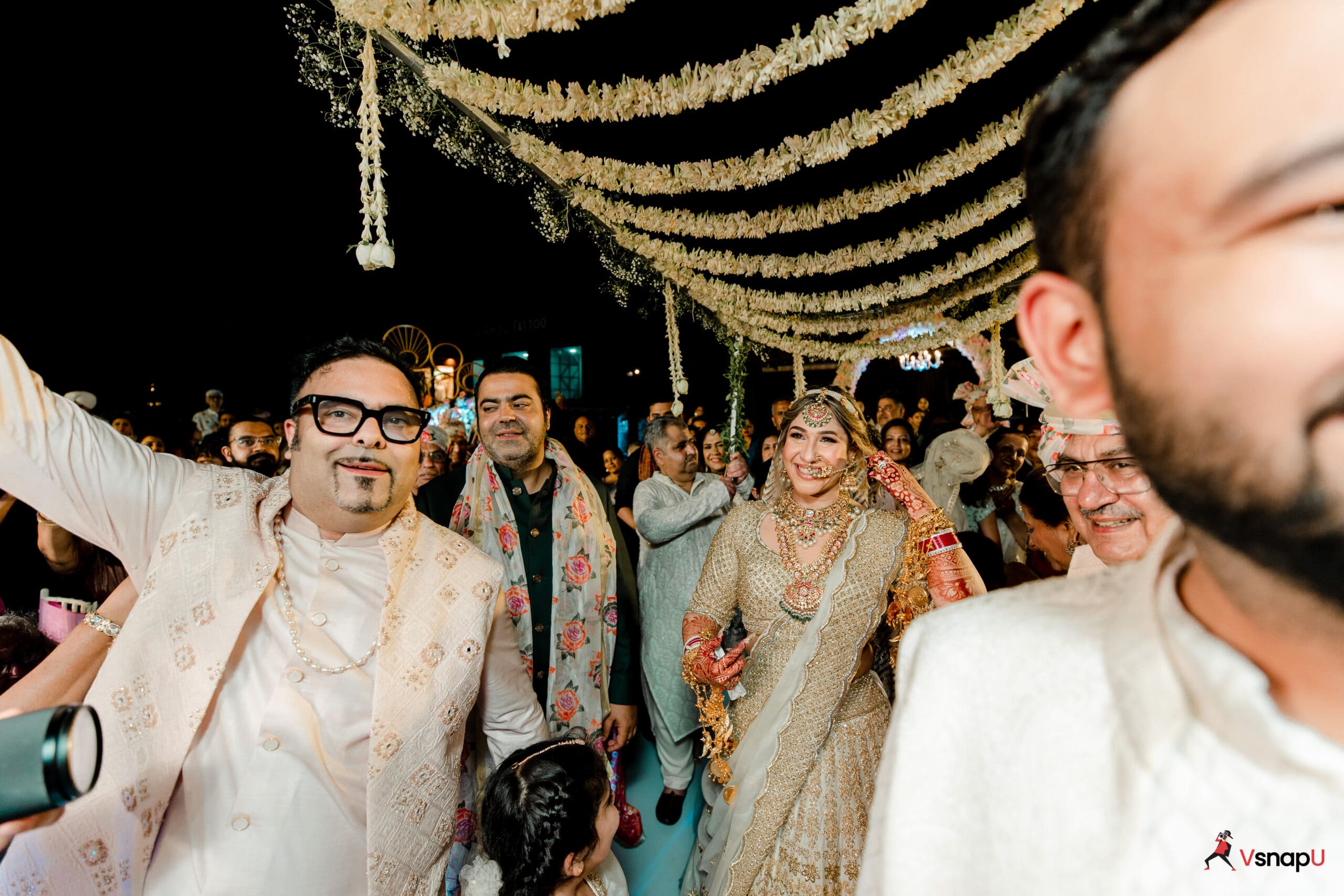 A breathtaking wedding entrance as the bride walks in with her brothers.